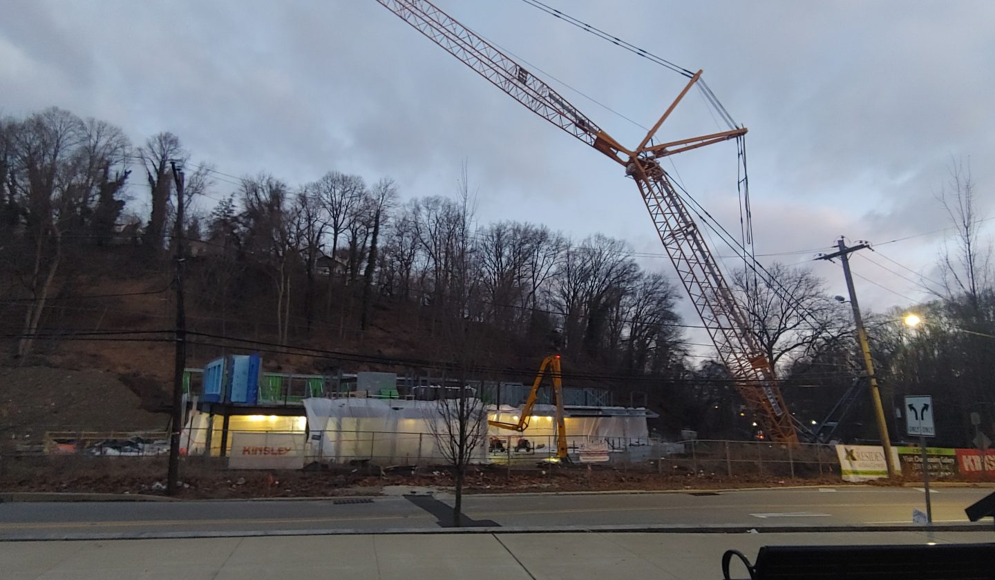 crane installing prefab walls
